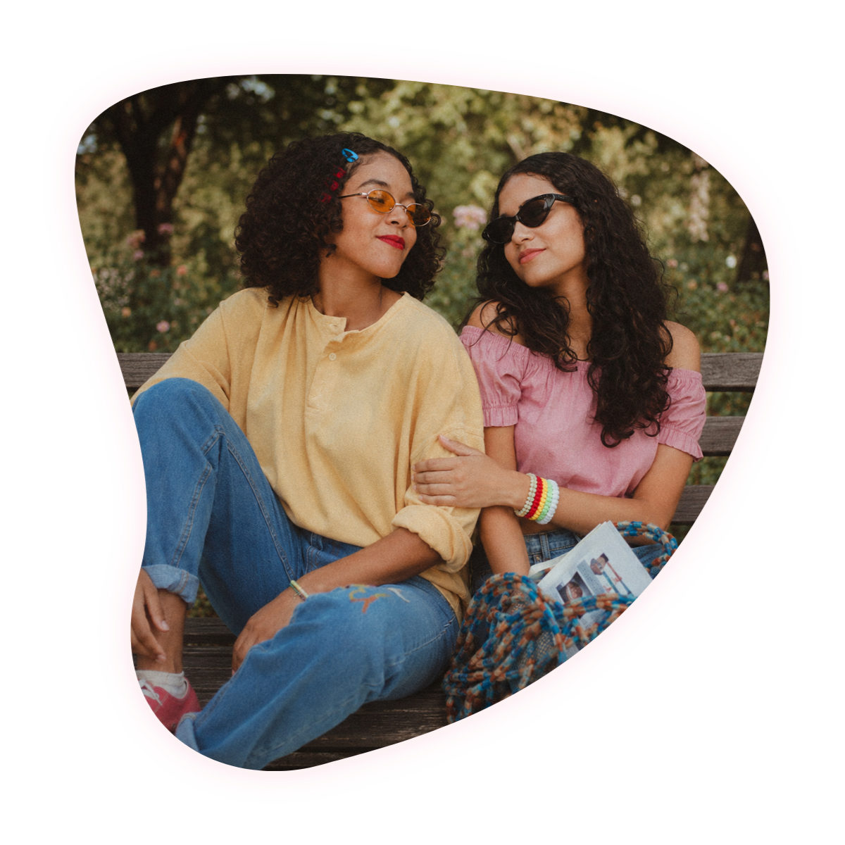 Two women sharing a light, playful conversation, an example of the difference between a casual friend and a true friend