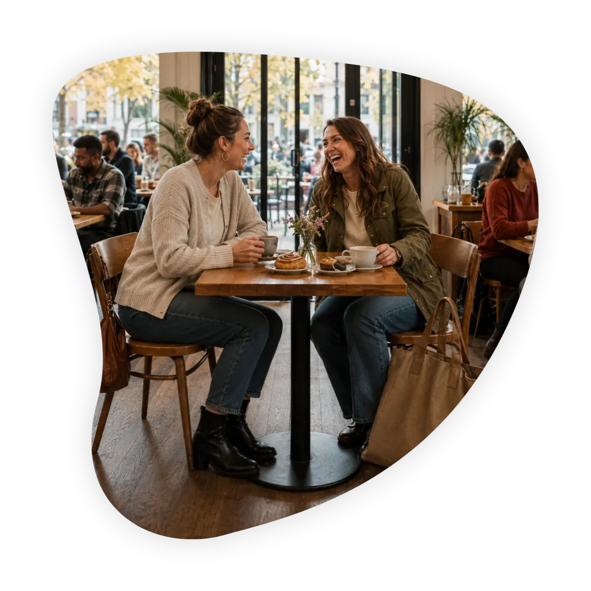 meeting a new friend for the first time: two women smiling and connecting over coffee